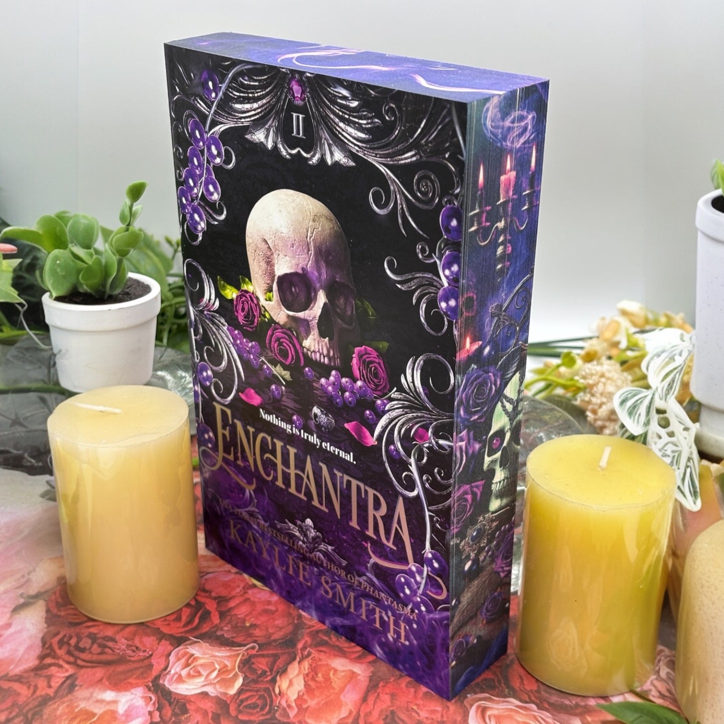 Close-up of custom printed book edges on Enchantra featuring candles and smoke