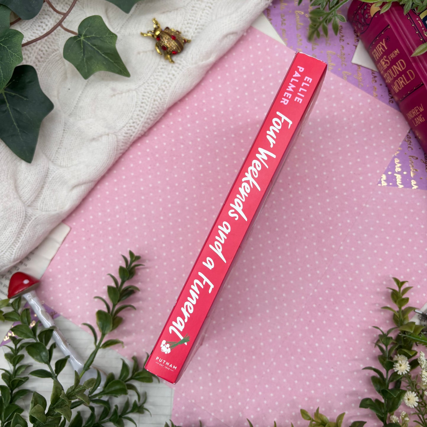 Four Weekends and a Funeral by Ellie Palmer special edition paperback with custom designed edges spine view