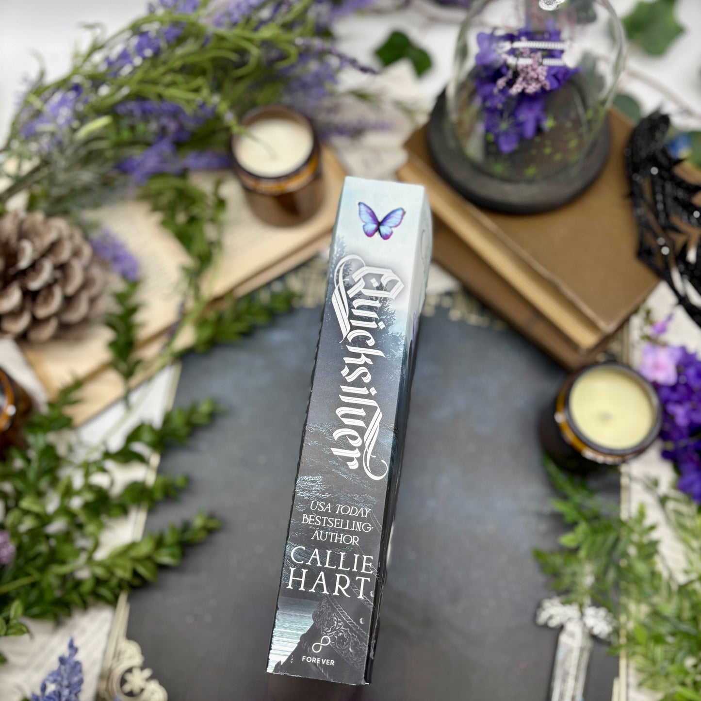 Spine of Quicksilver special edition paperback by Callie Hart with printed edges