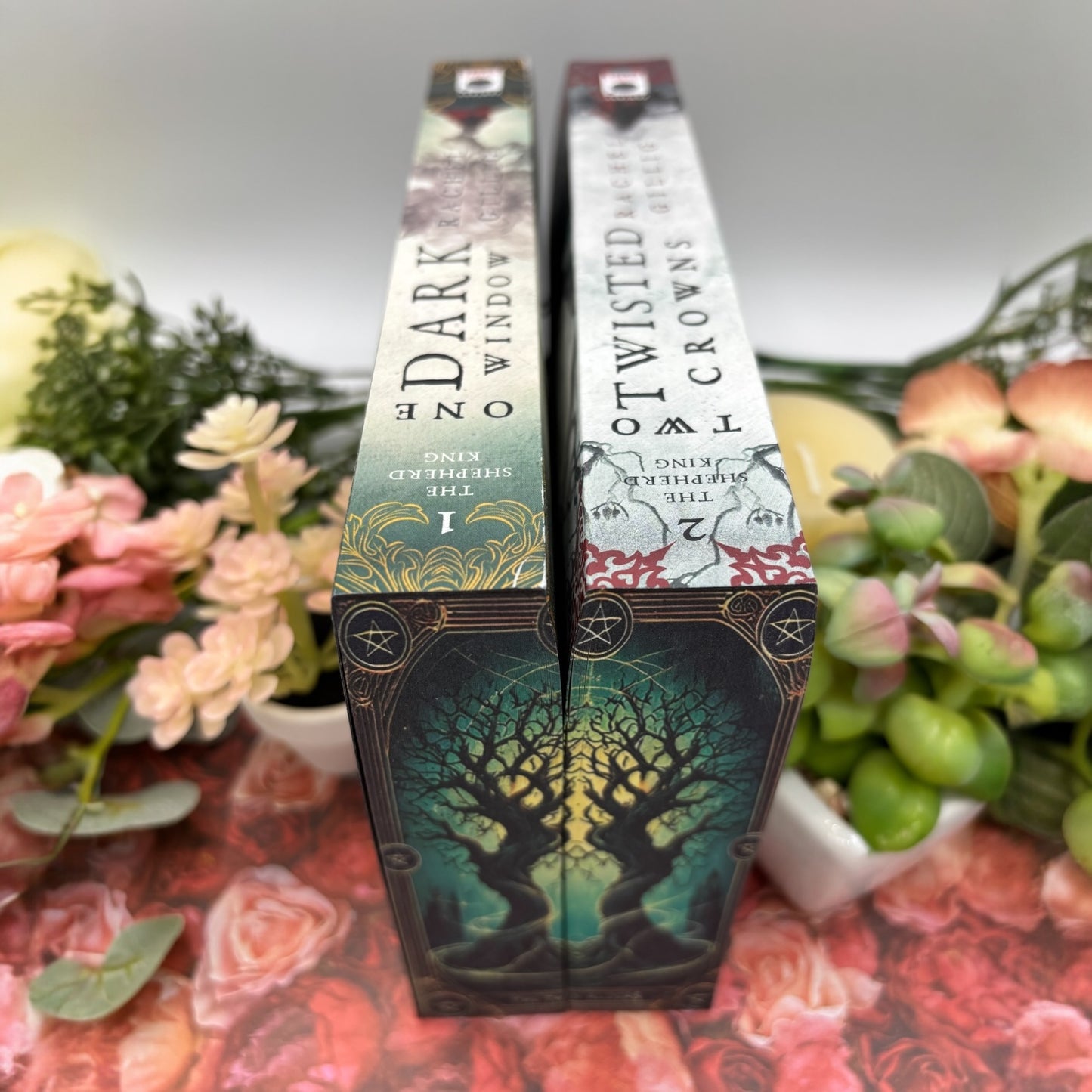 Special edition paperback set of One Dark Window and Two Twisted Crowns by Rachel Gillig tops