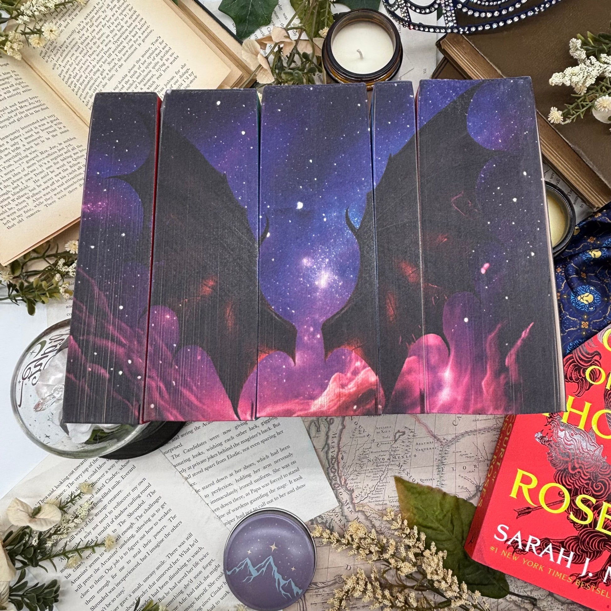 Close-up of night sky and bat wings sprayed edges on ACOTAR Velaris Edition paperbacks