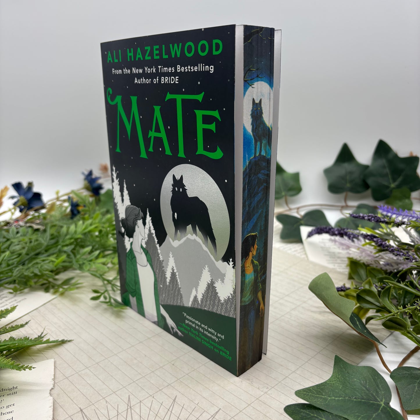 Close-up view of the stenciled book edges on the paperback edition of Mate by Ali Hazelwood