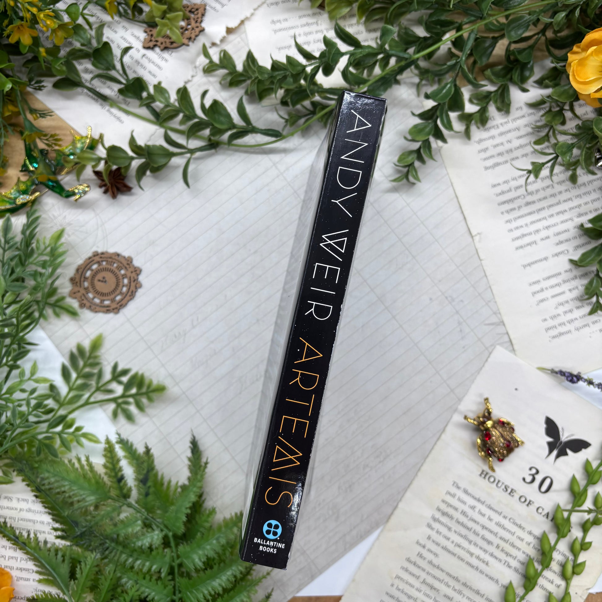 Artemis by Andy Weir special edition paperback with custom designed edges spine view