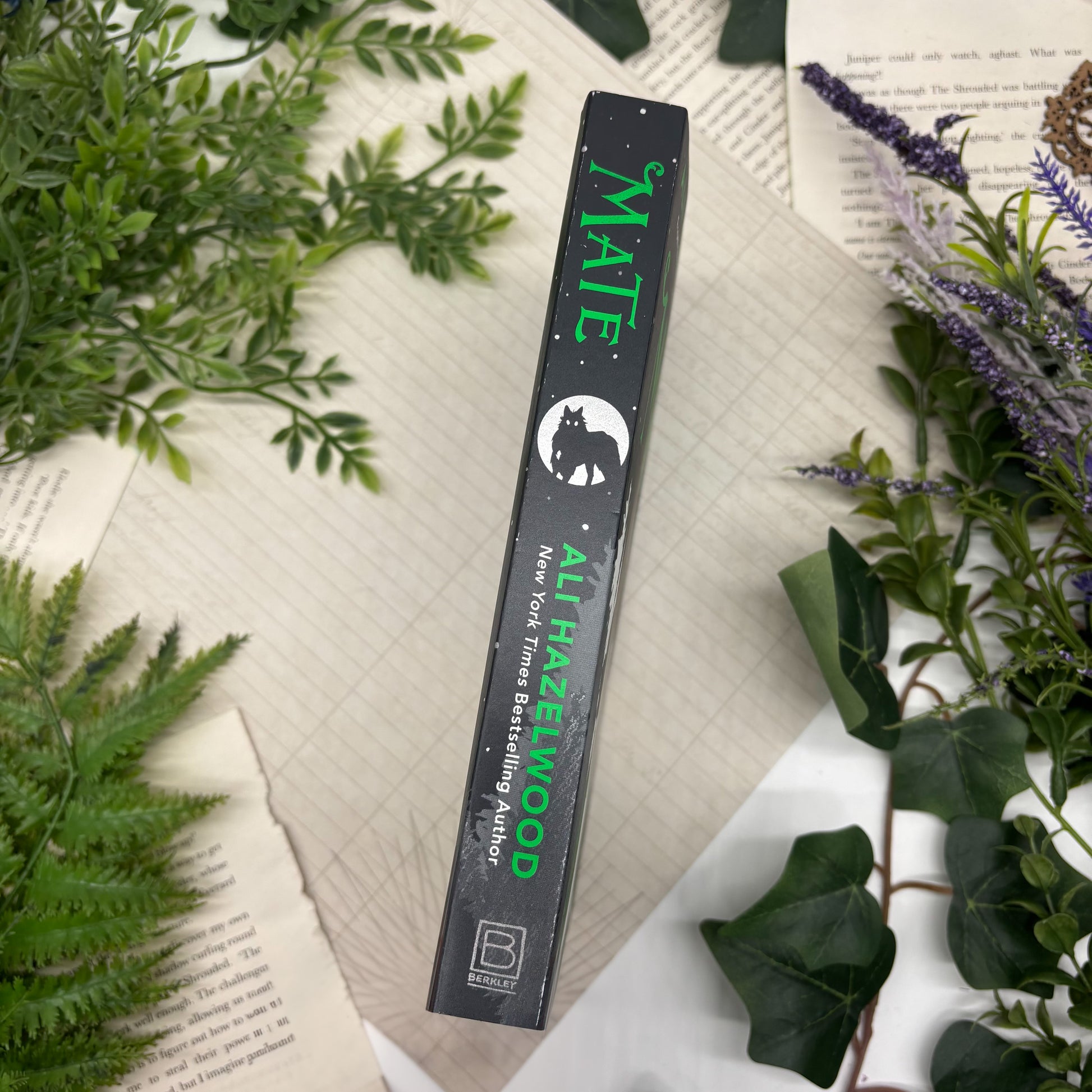 Special edition of Mate by Ali Hazelwood with custom stenciled edges, paperback book on display