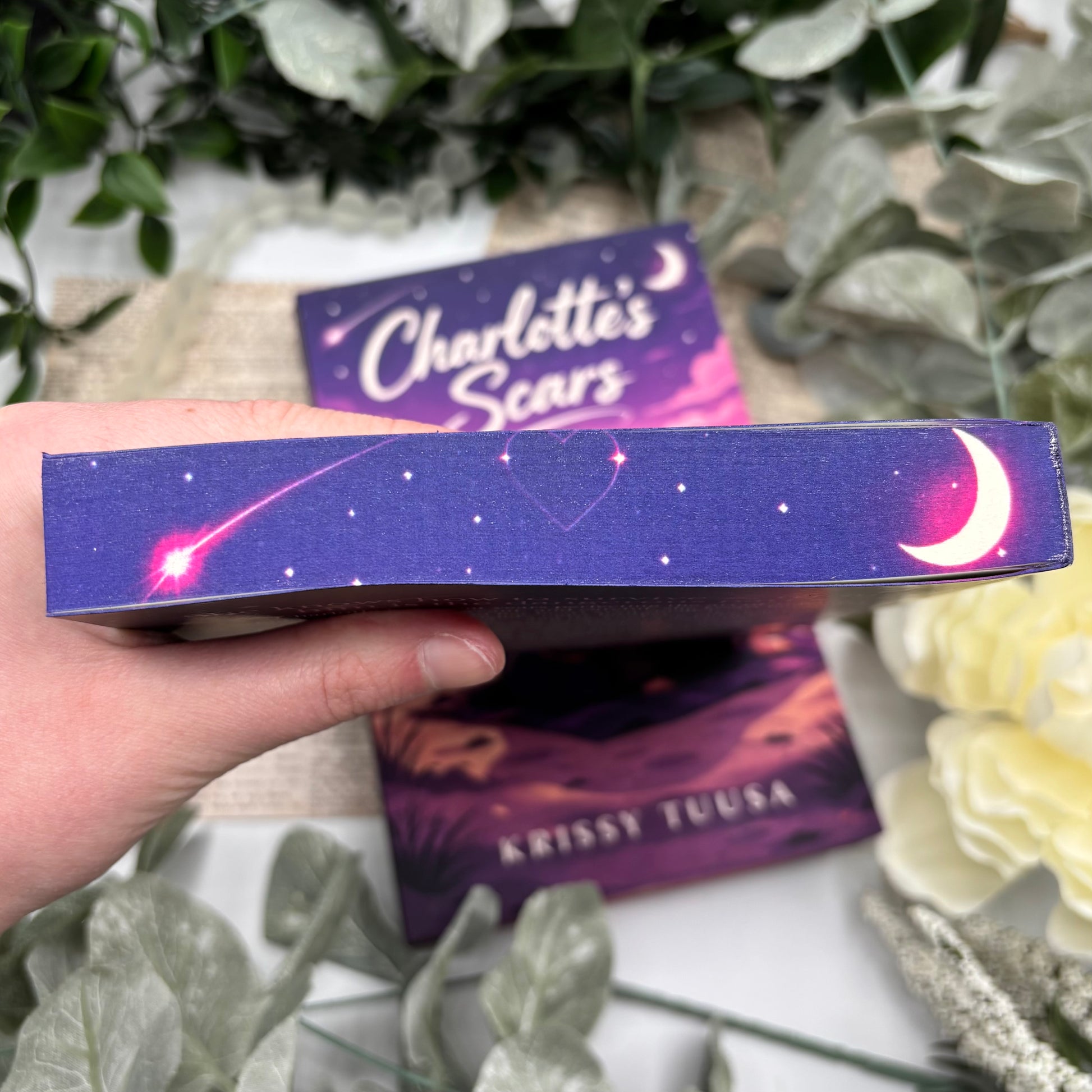 close up of top custom sprayed edges on Charlotte’s Scars by Krissy Tuusa special edition paperback