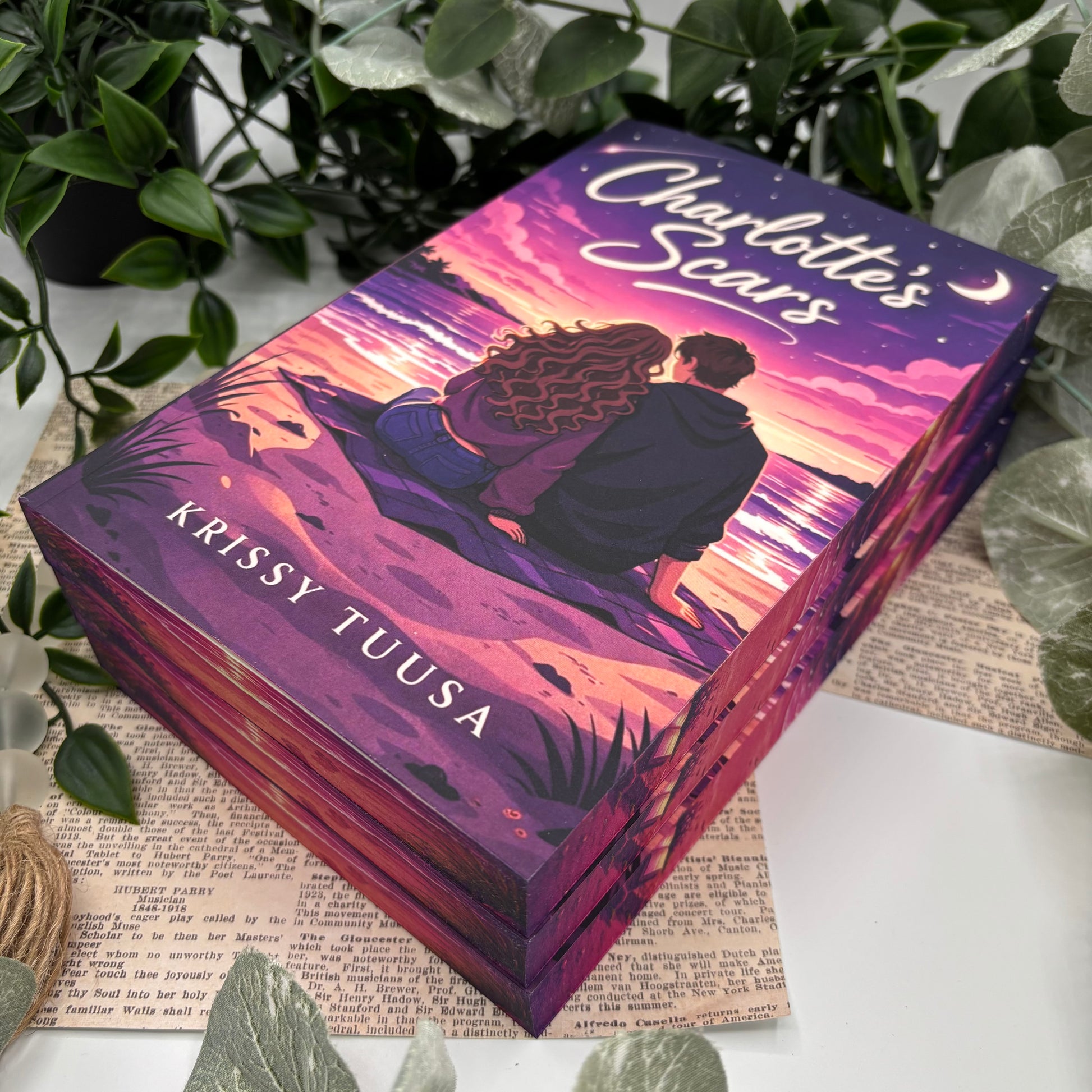 side view of Charlotte’s Scars paperback showing custom sprayed edges special edition