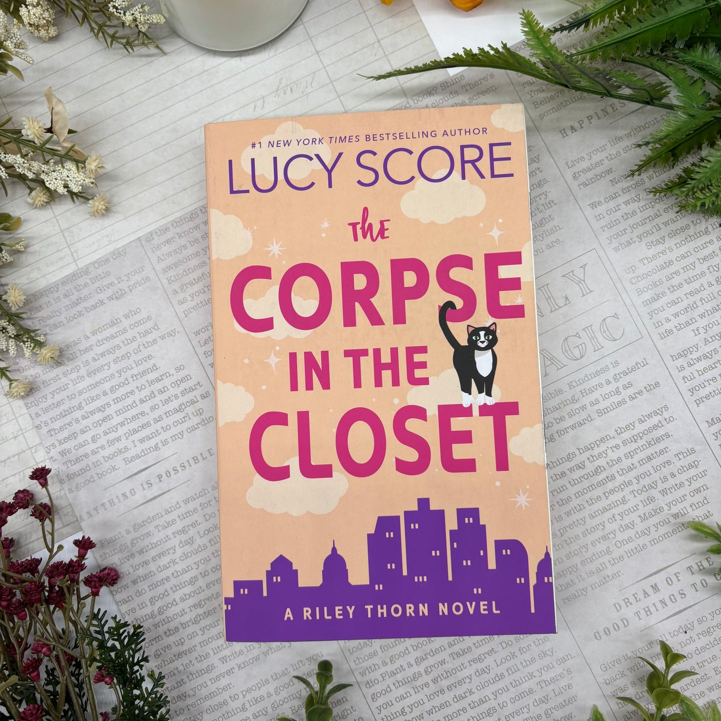 The Corpse in the Closet by Lucy Score special edition paperback with custom designed edges front cover view