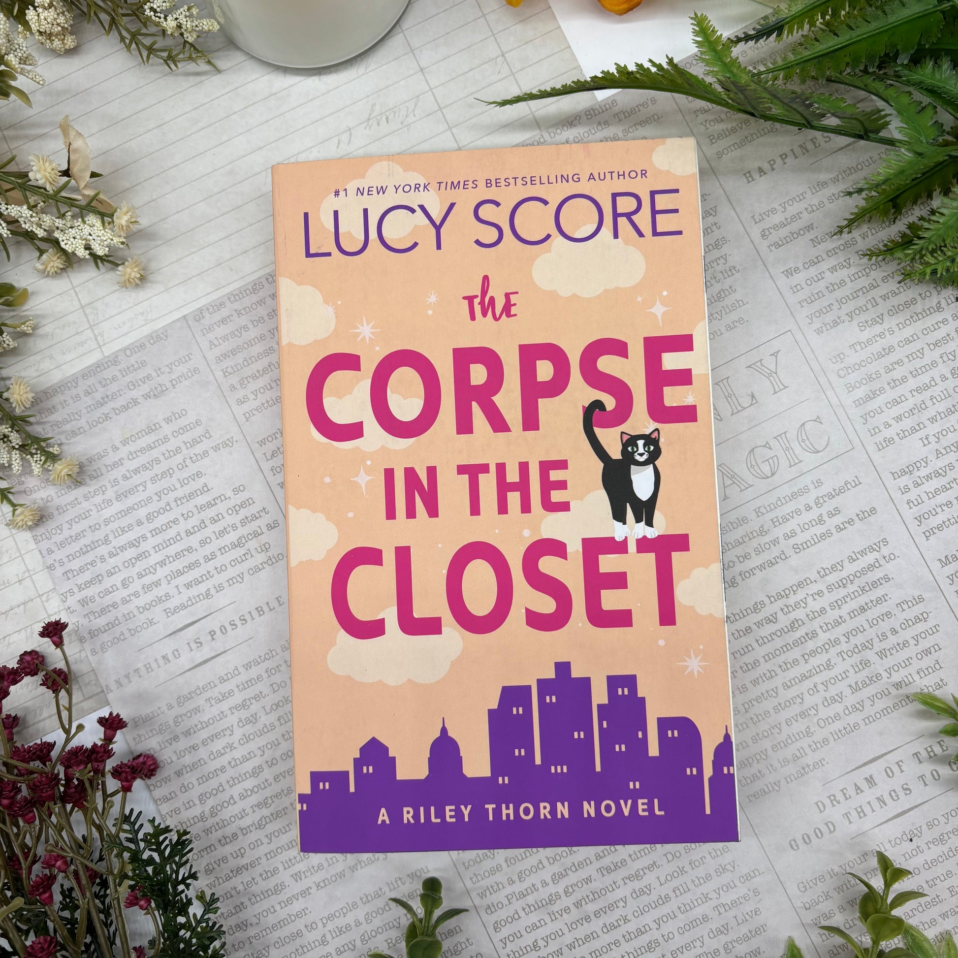 The Corpse in the Closet by Lucy Score special edition paperback with custom designed edges front cover view