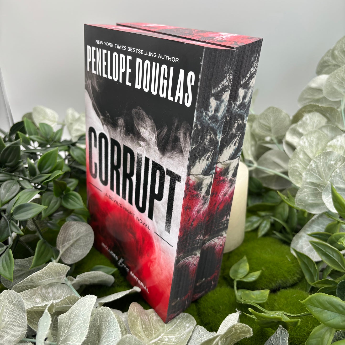 Corrupt by Penelope Douglas special edition paperback with custom designed edges side view