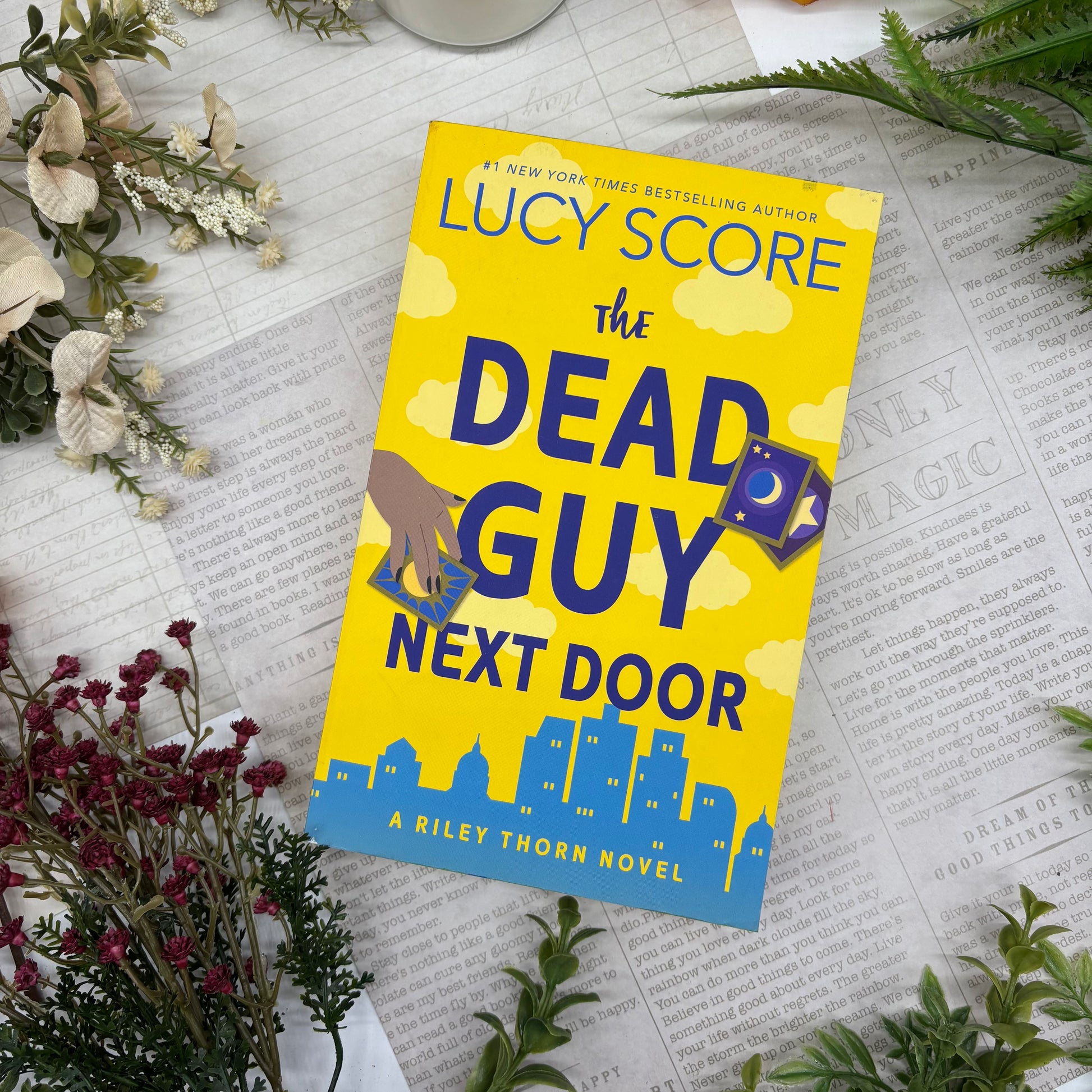 The Dead Guy Next Door by Lucy Score special edition paperback with custom designed edges front cover view