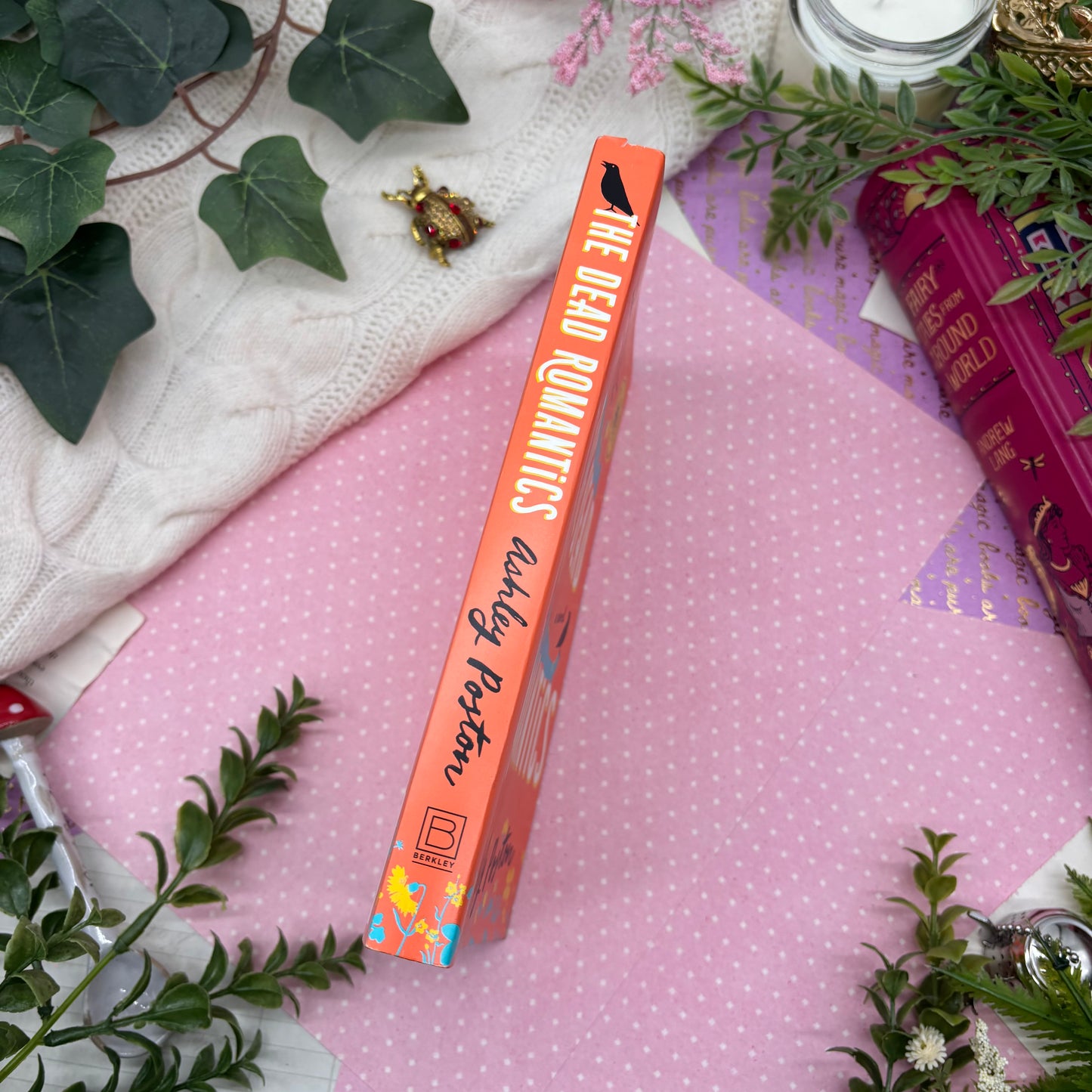 The Dead Romantics by Ashley Poston special edition paperback with custom designed edges spine view