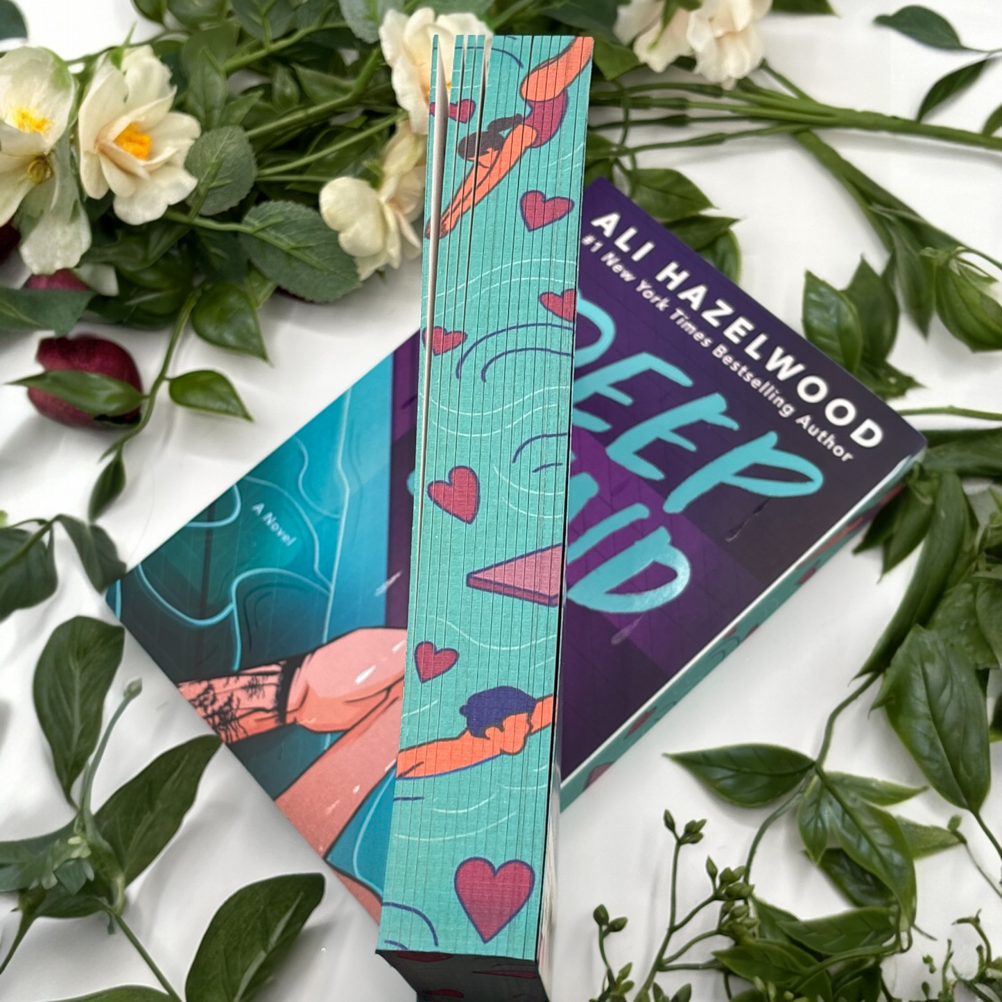 close up of custom edges on Deep End by Ali Hazelwood special edition paperback