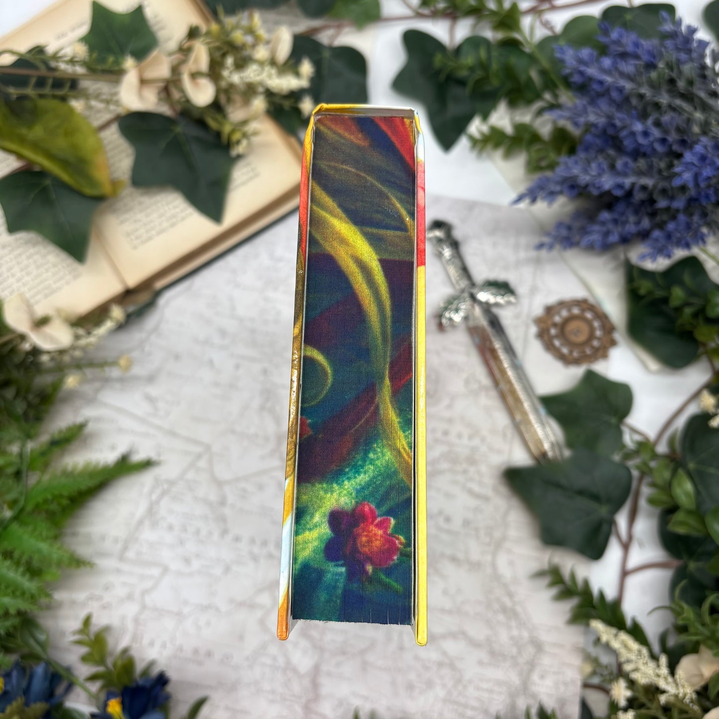 Special edition hardcover of Her Radiant Curse by Elizabeth Lim with stenciled edges