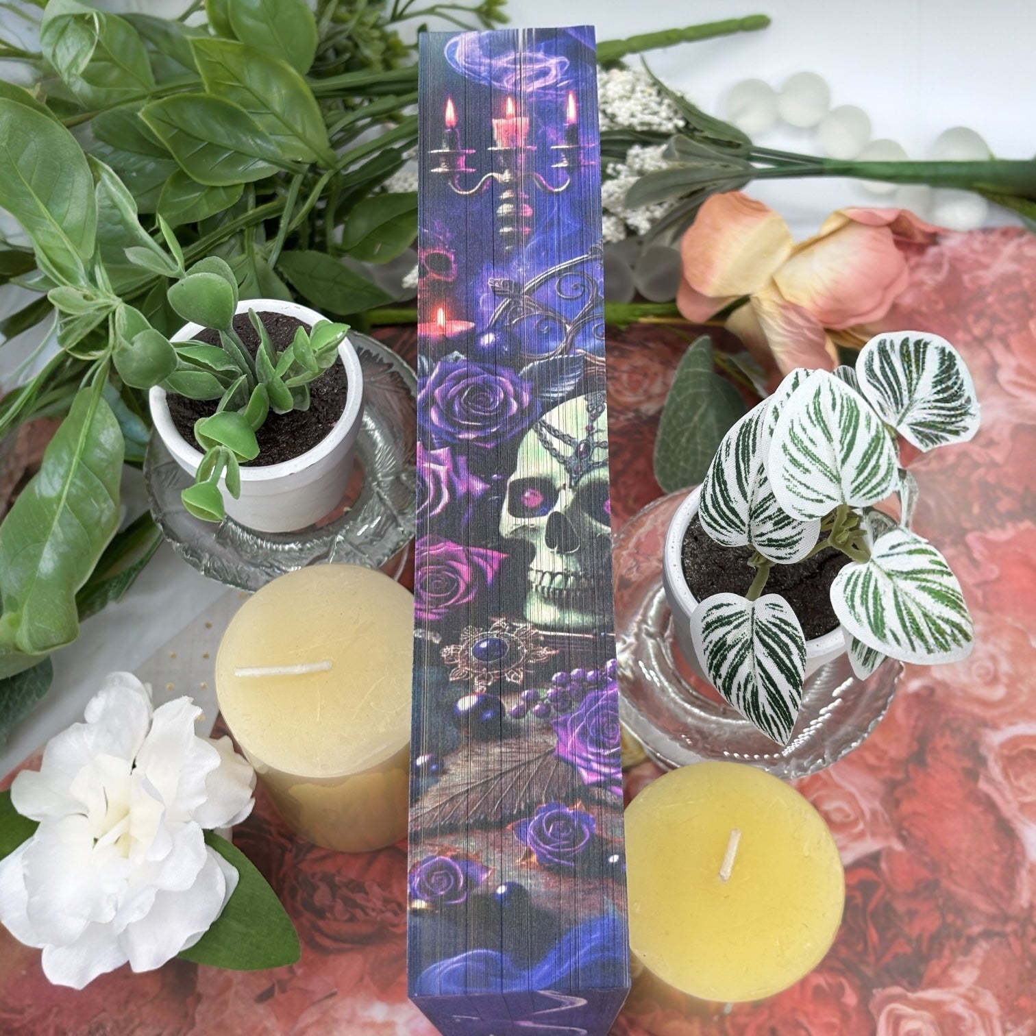 Close-up of custom printed book edges on Enchantra featuring candles and smoke
