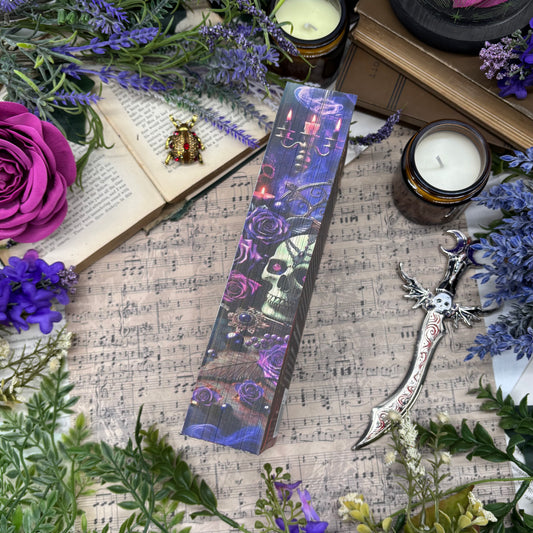 Close-up of custom printed book edges on Enchantra featuring candles and smoke