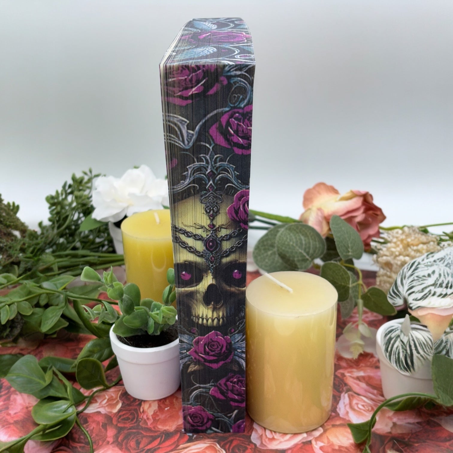 Enchantra special edition paperback by Kaylie Smith with skull and rose edge design