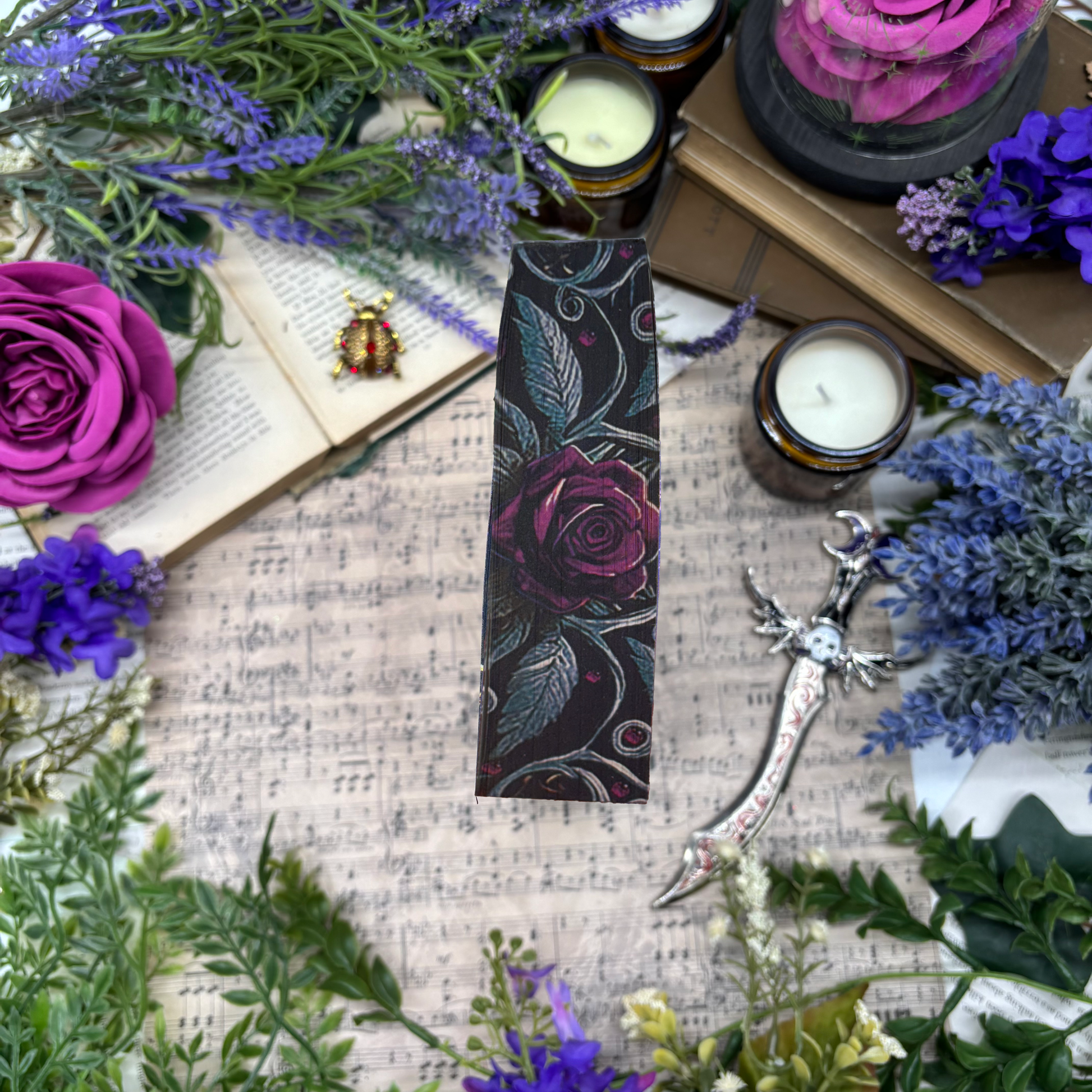 Enchantra special edition paperback by Kaylie Smith with skull and rose edge design