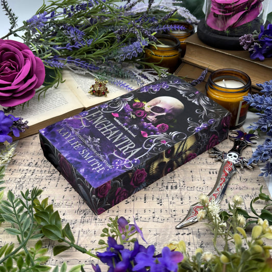 Front cover of Enchantra special edition paperback by Kaylie Smith with skull and rose edge design