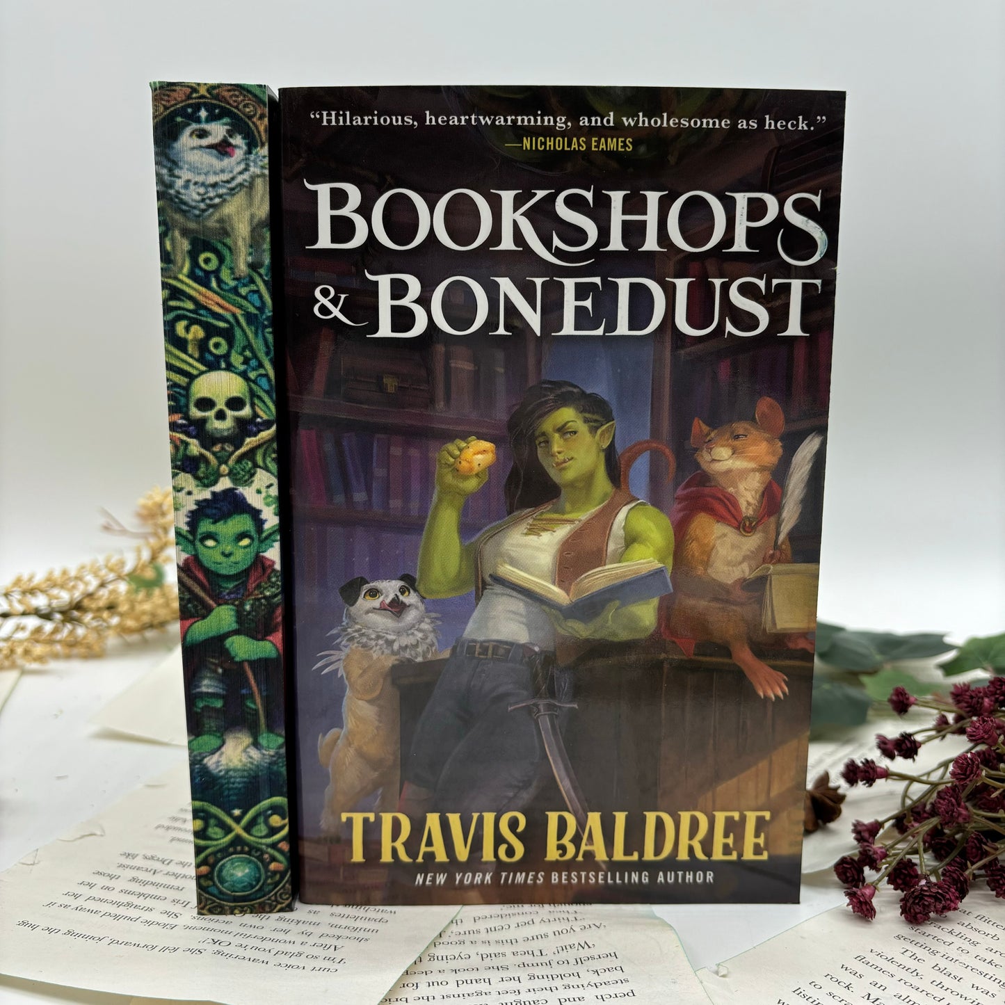 Custom edge-painted fantasy paperback Bookshops and Bonedus