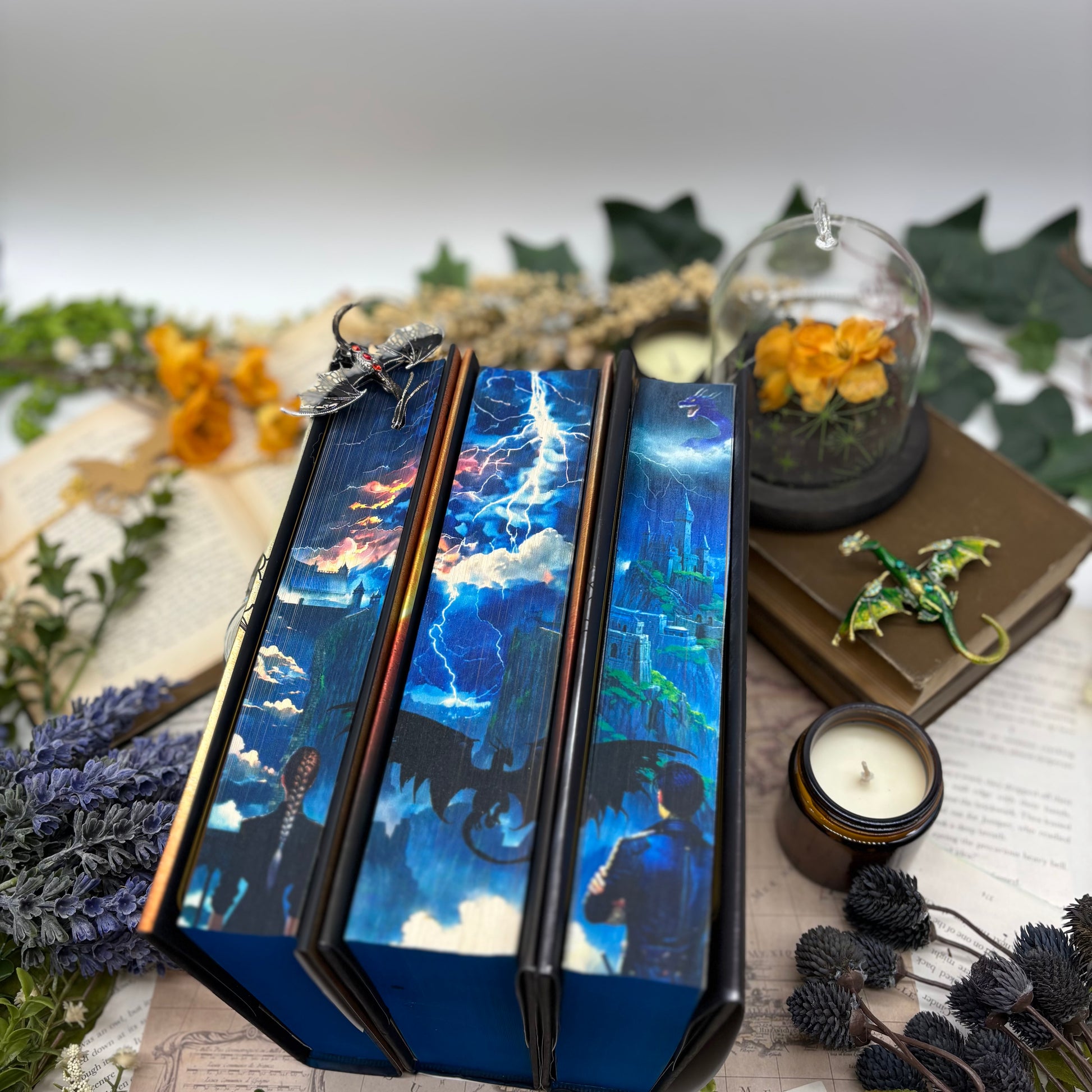 Fourth Wing, Iron Flame, and Onyx Storm special edition hardcovers with sprayed edges