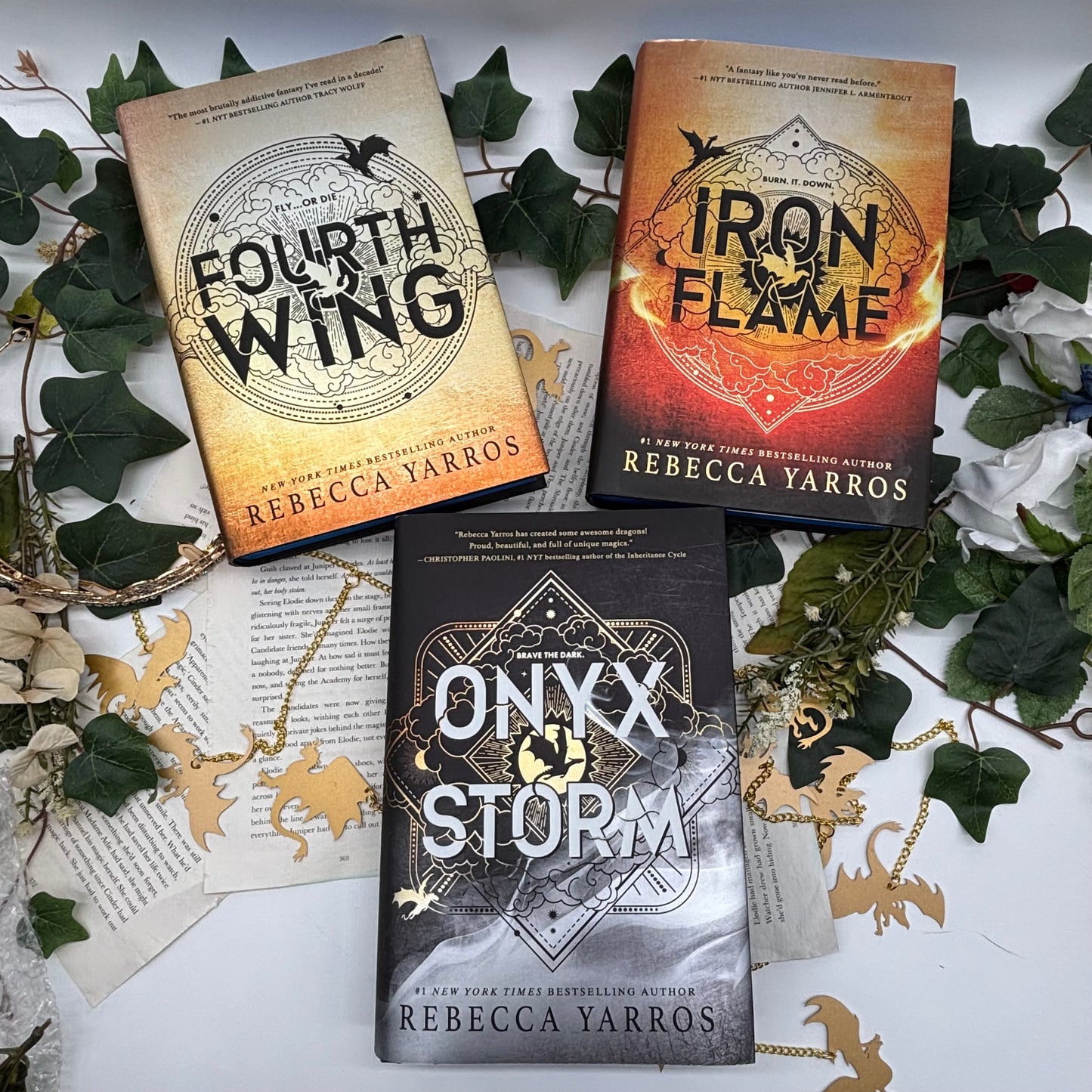 Fourth Wing, Iron Flame, and Onyx Storm special edition hardcovers with sprayed edges front covers