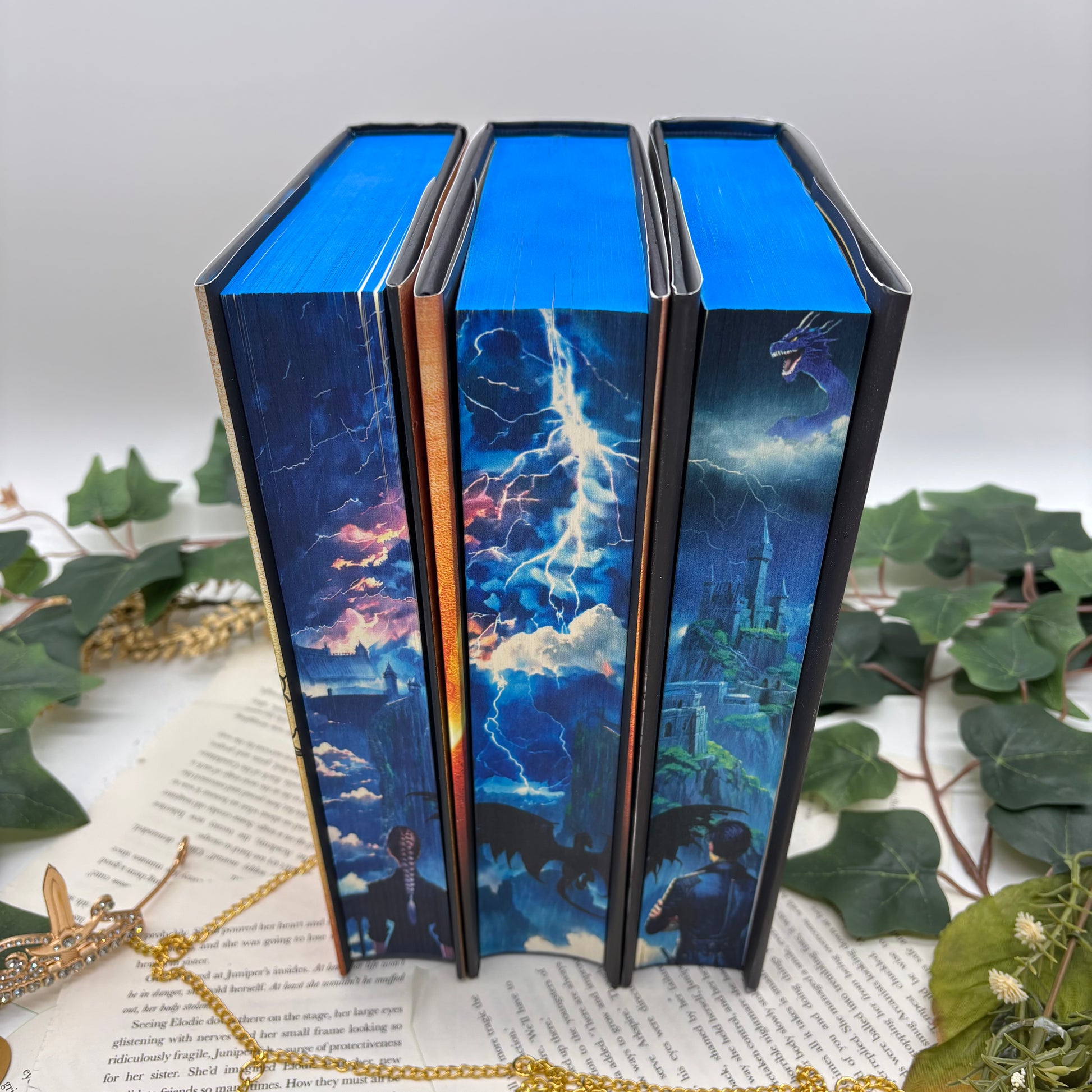 Fourth Wing, Iron Flame, and Onyx Storm special edition hardcovers with sprayed edges