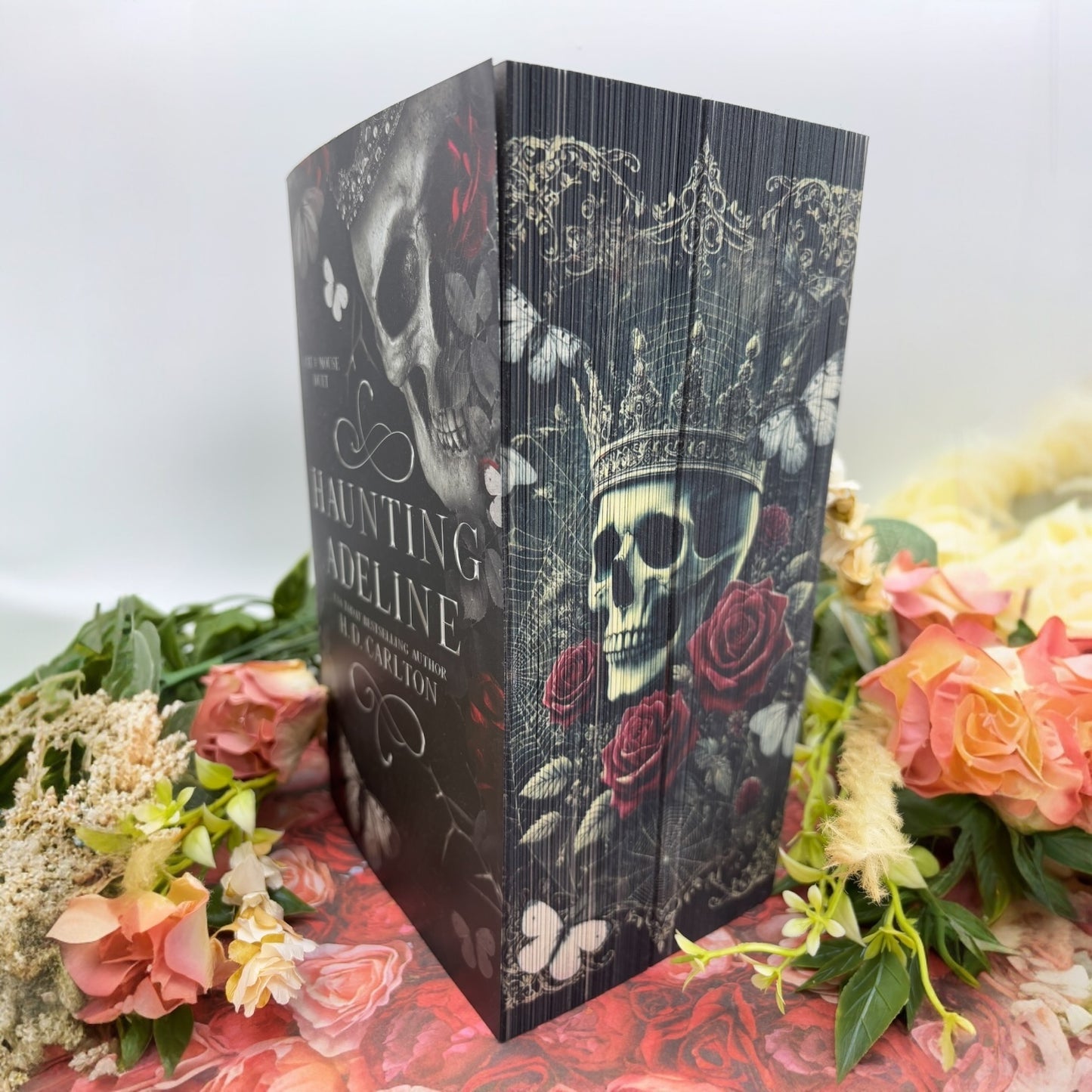 Special edition paperback set of Haunting Adeline and Hunting Adeline by H.D. Carlton with custom edges