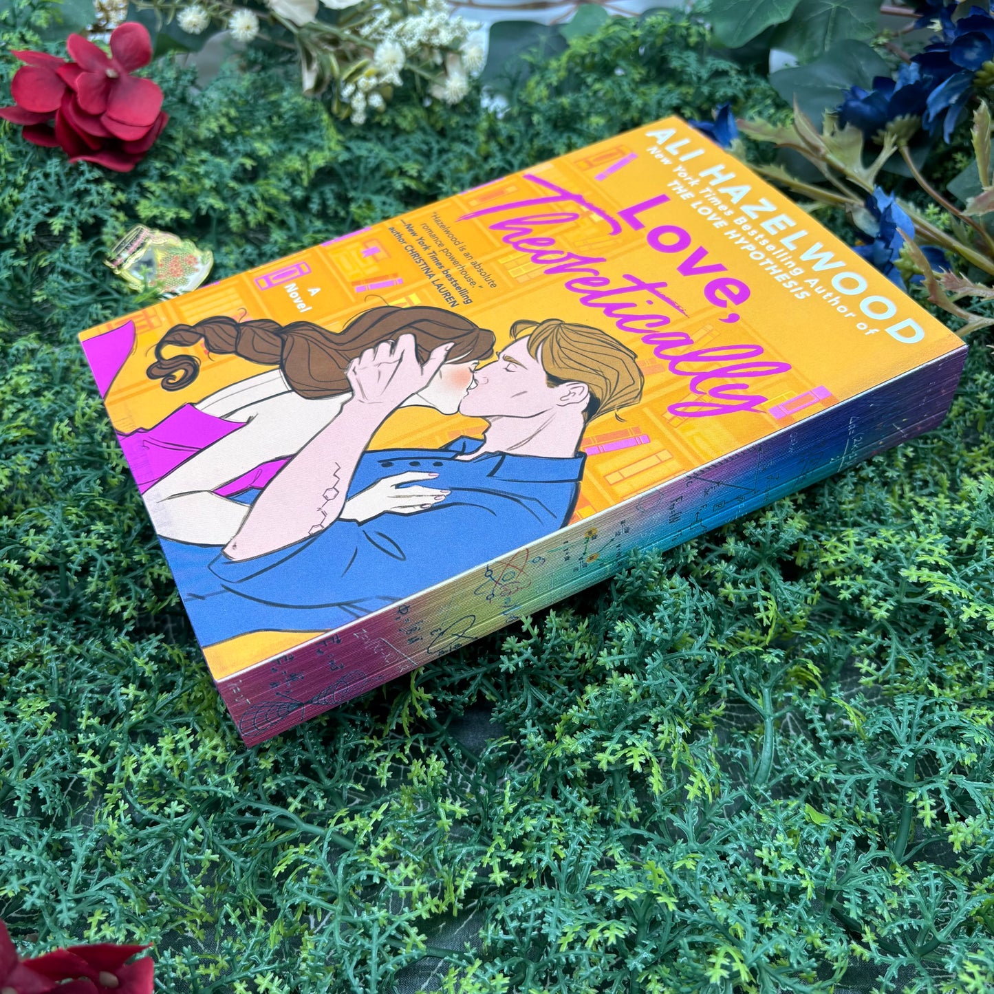 close up of custom sprayed edges on Love, Theoretically by Ali Hazelwood special edition paperback