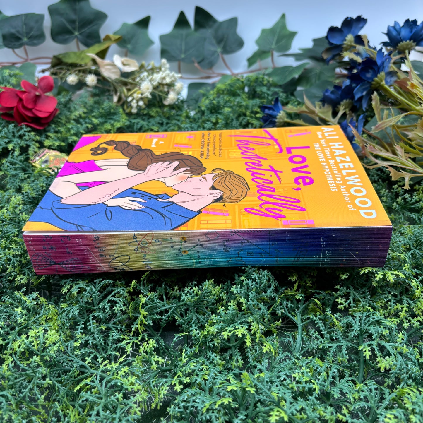 side view of Love, Theoretically paperback showing custom sprayed edges special edition