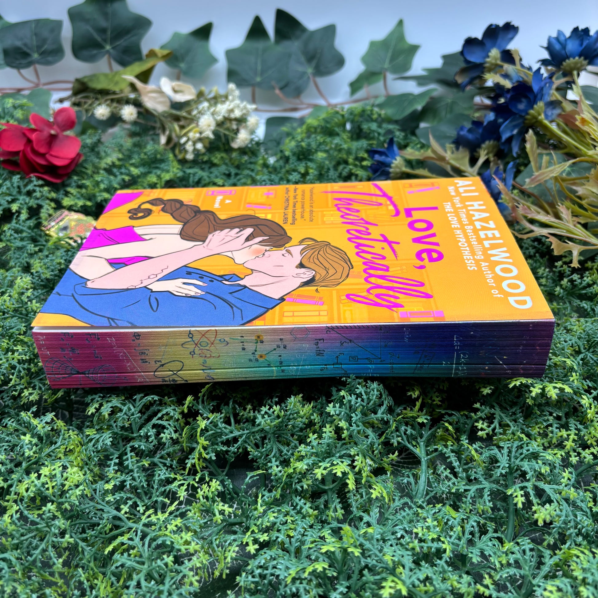 side view of Love, Theoretically paperback showing custom sprayed edges special edition