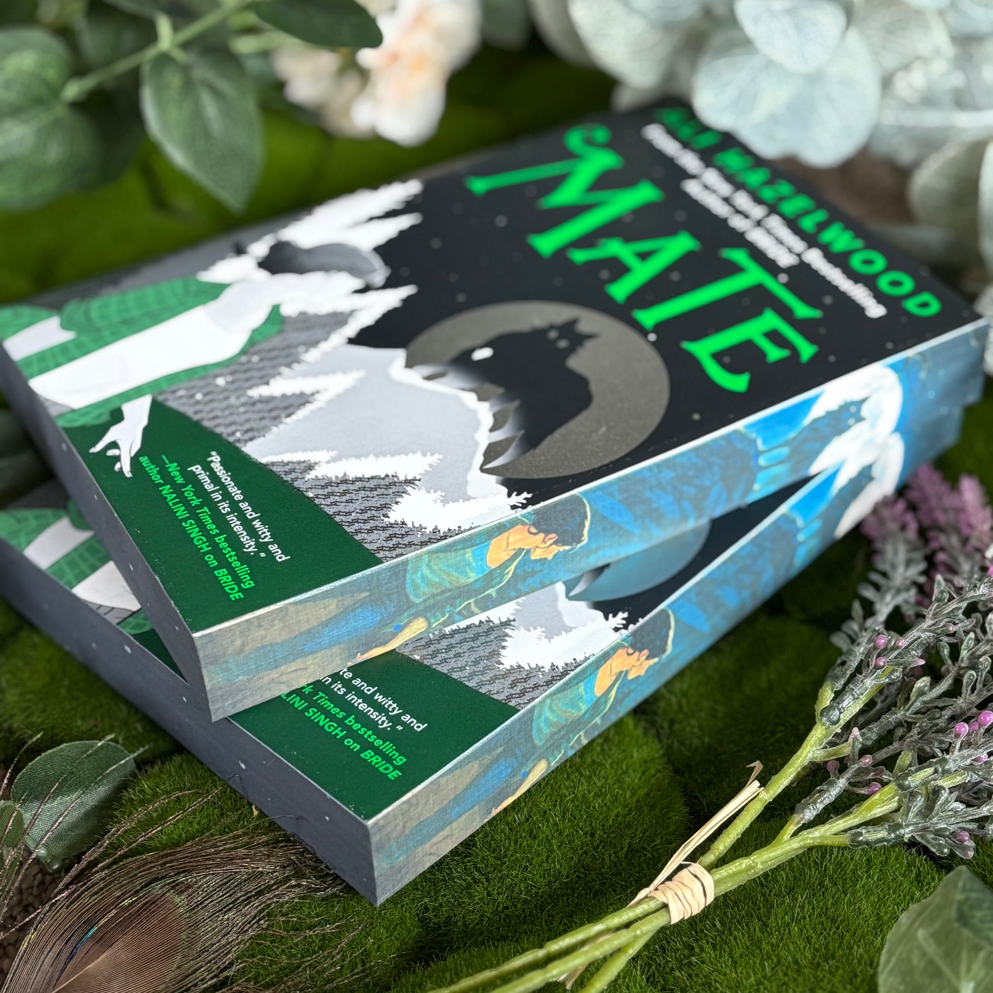 Special edition of Mate by Ali Hazelwood with custom stenciled edges, paperback book on display