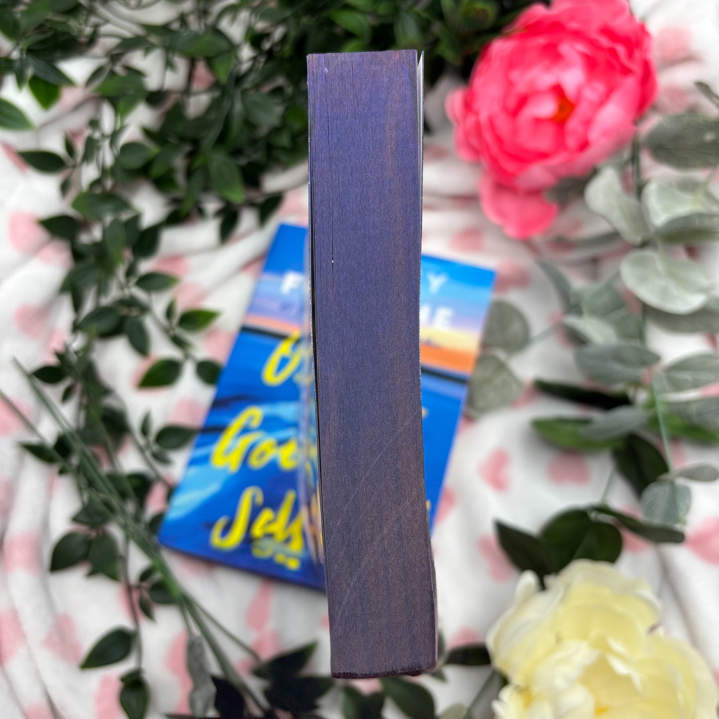 bottom view of One Golden Summer paperback showing custom sprayed edges special edition