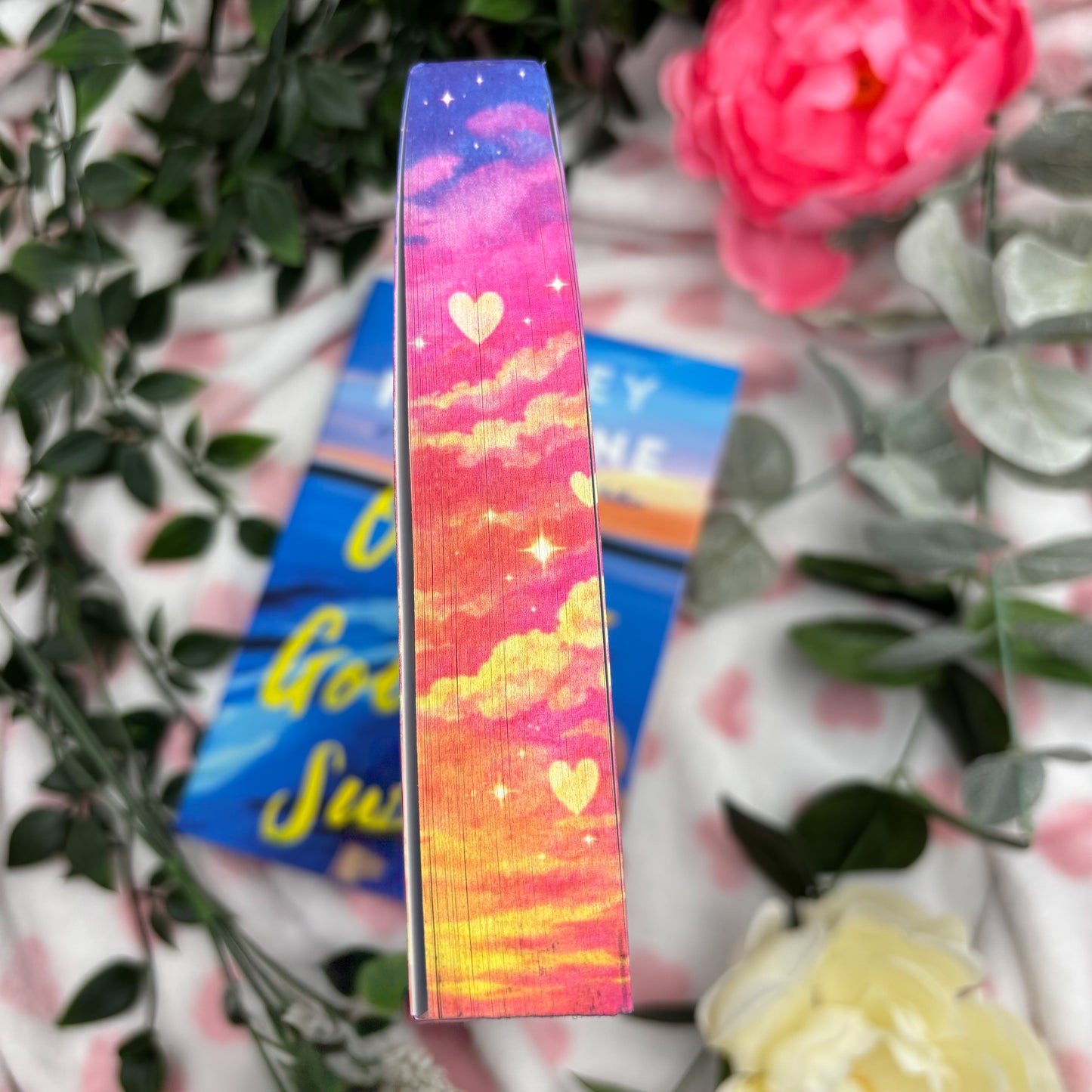 top view of custom sprayed edges on One Golden Summer by Carley Fortune special edition paperback
