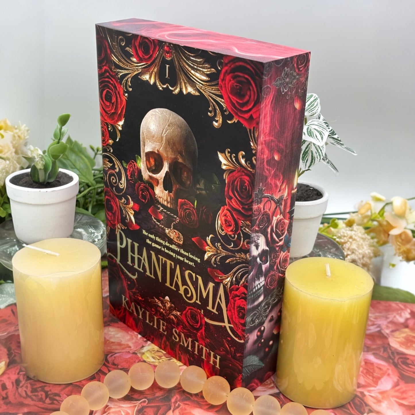 Close-up of custom printed book edges on Phantasma with candles and smoke design