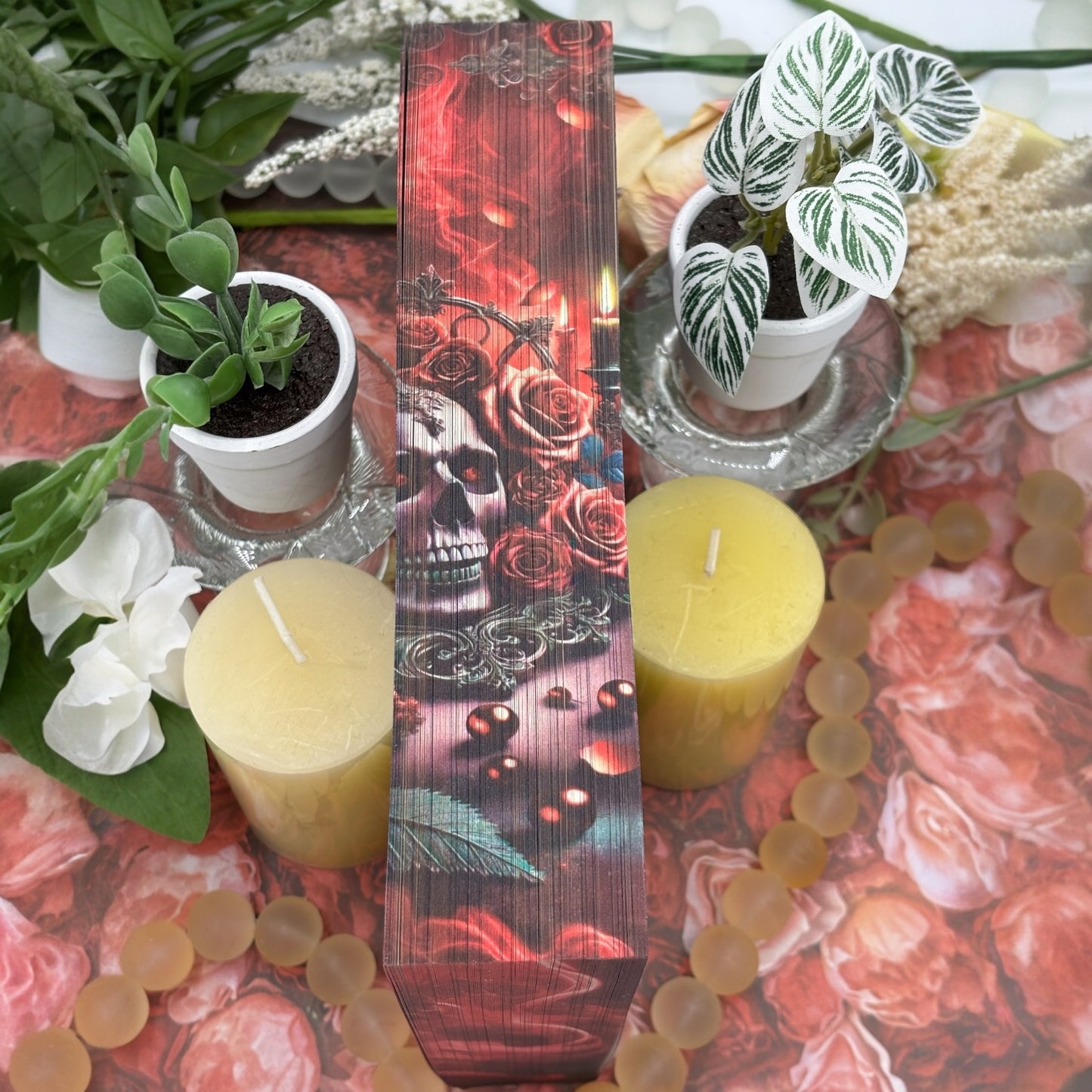 Close-up of custom printed book edges on Phantasma with candles and smoke design