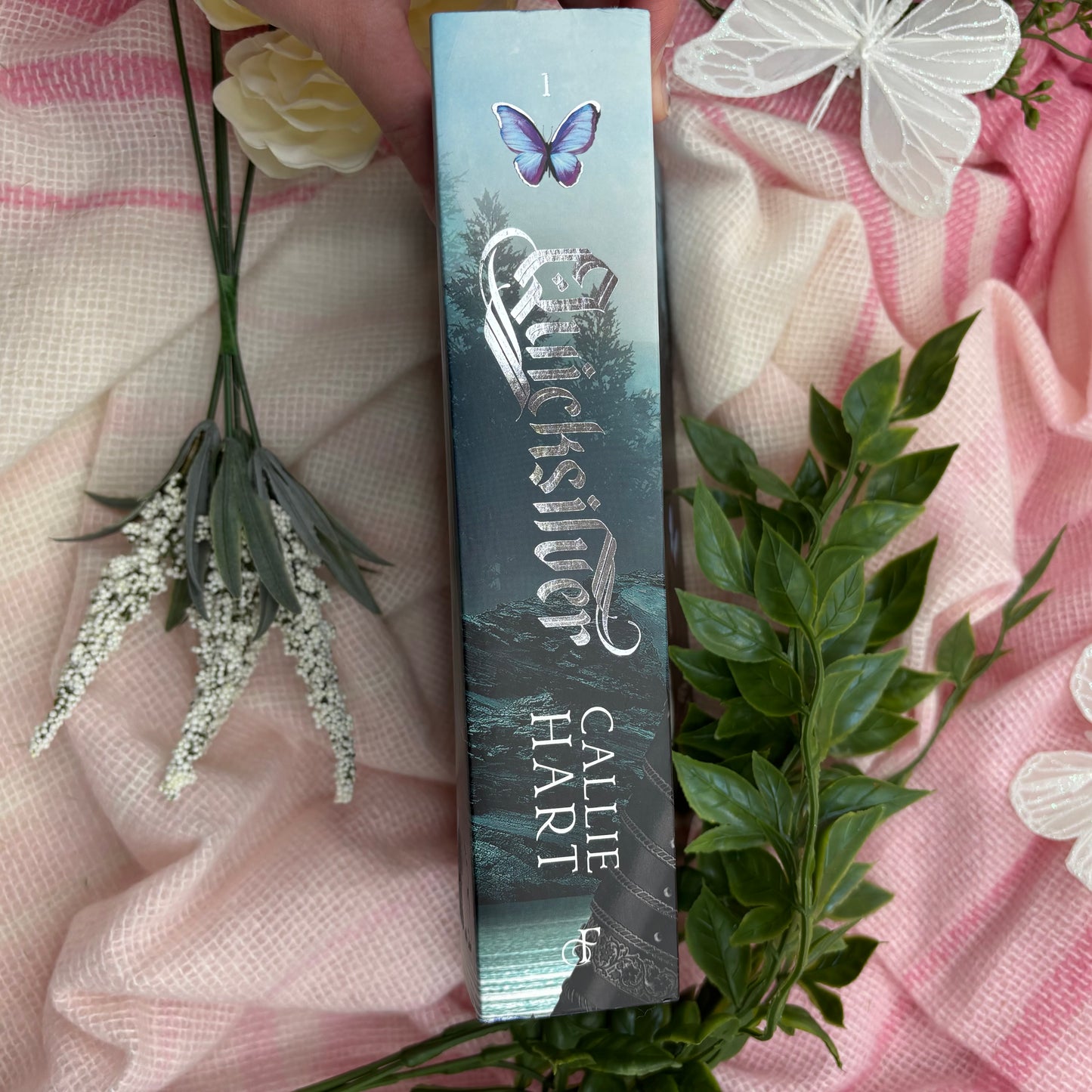 Quicksilver special edition paperback by Callie Hart with printed edges spine view