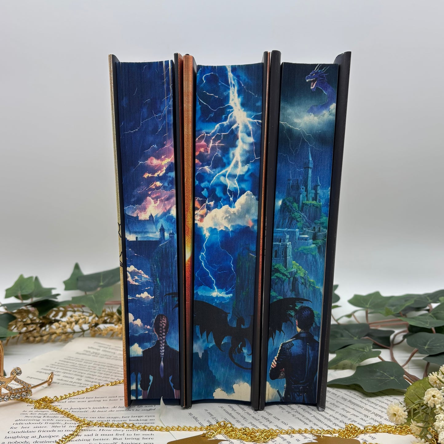 Fourth Wing, Iron Flame, and Onyx Storm special edition hardcovers with sprayed edges