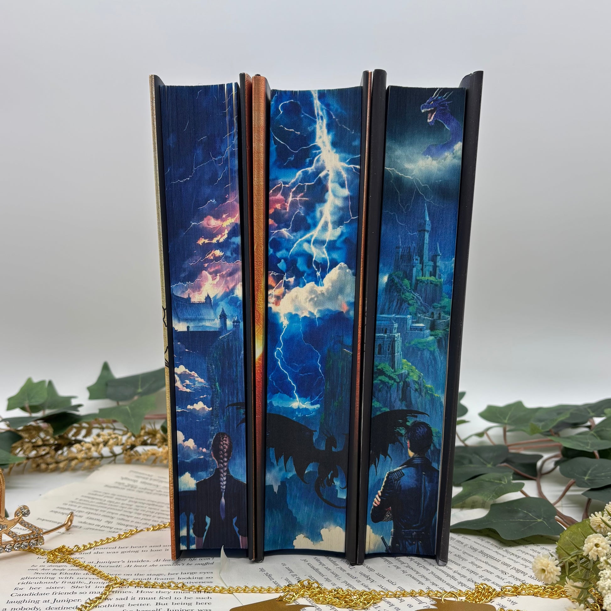 Fourth Wing, Iron Flame, and Onyx Storm special edition hardcovers with sprayed edges
