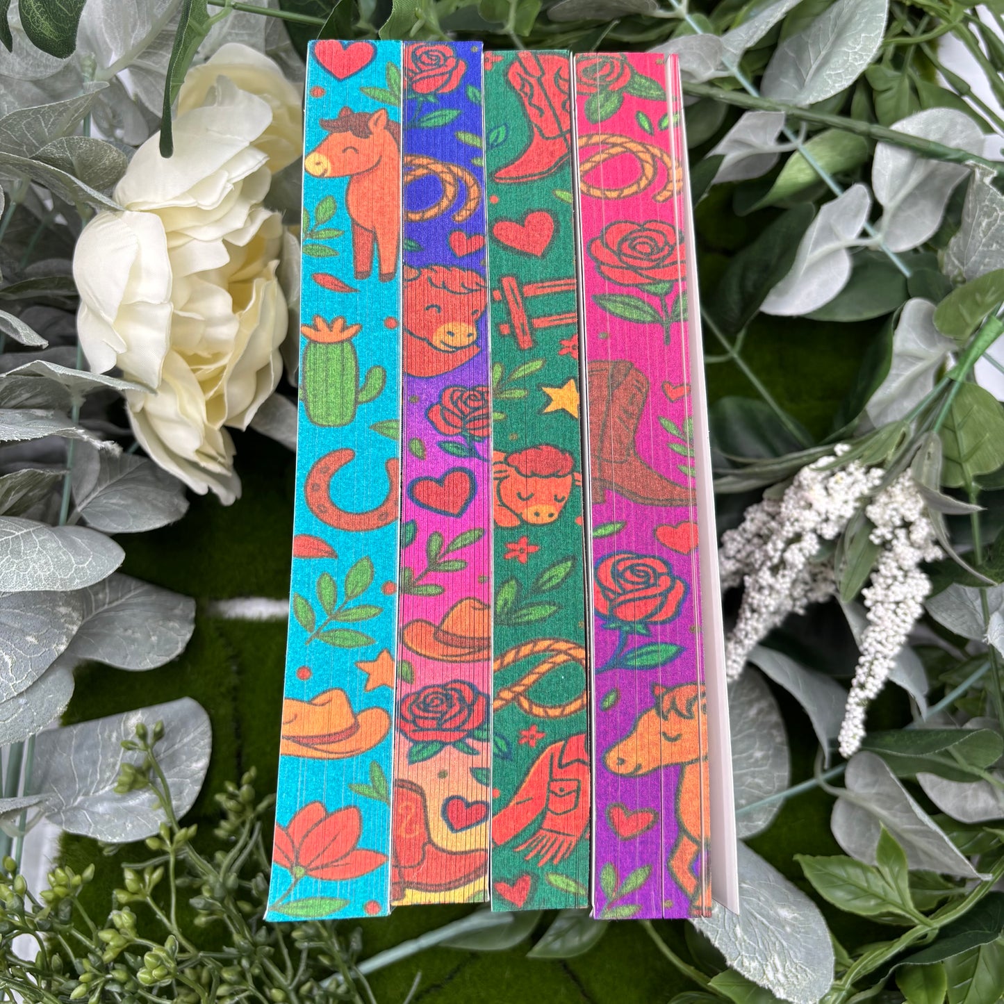 close up of custom sprayed edges across Rebel Blue Ranch special edition book set