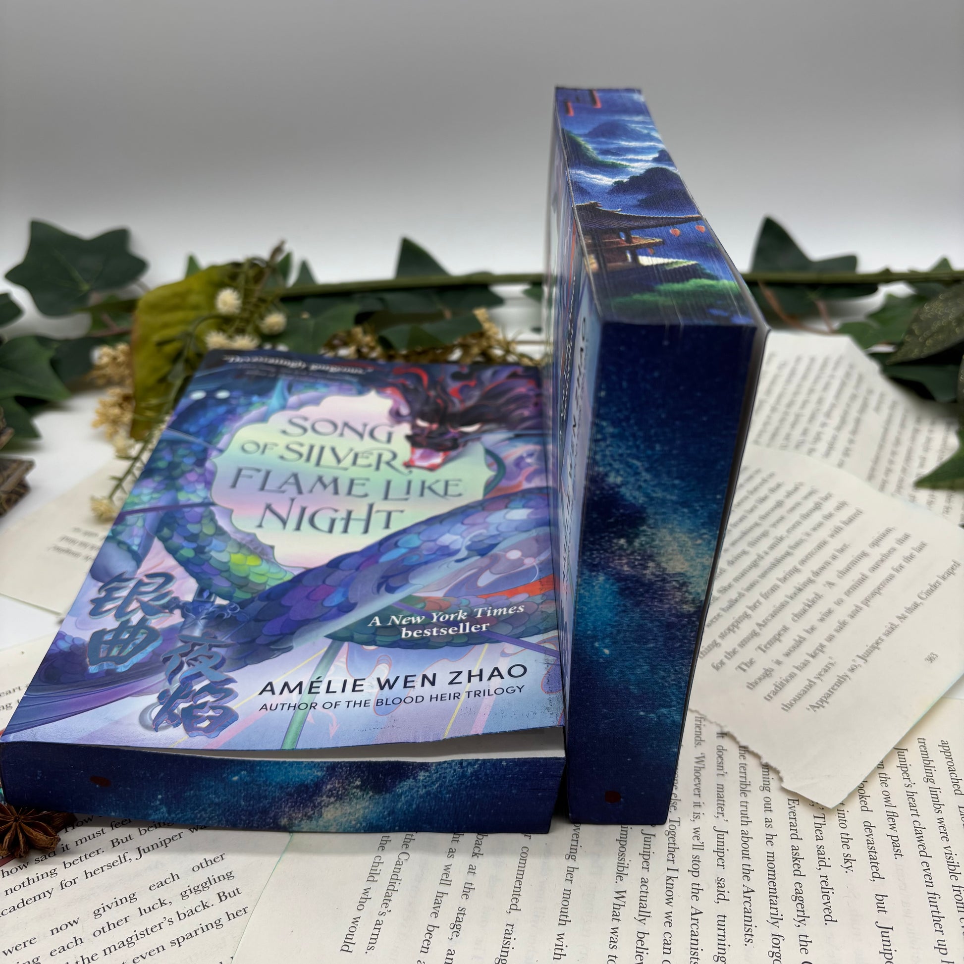 Song of Silver Flame Like Night by Amélie Wen Zhao special edition paperback with custom designed edges bottom view