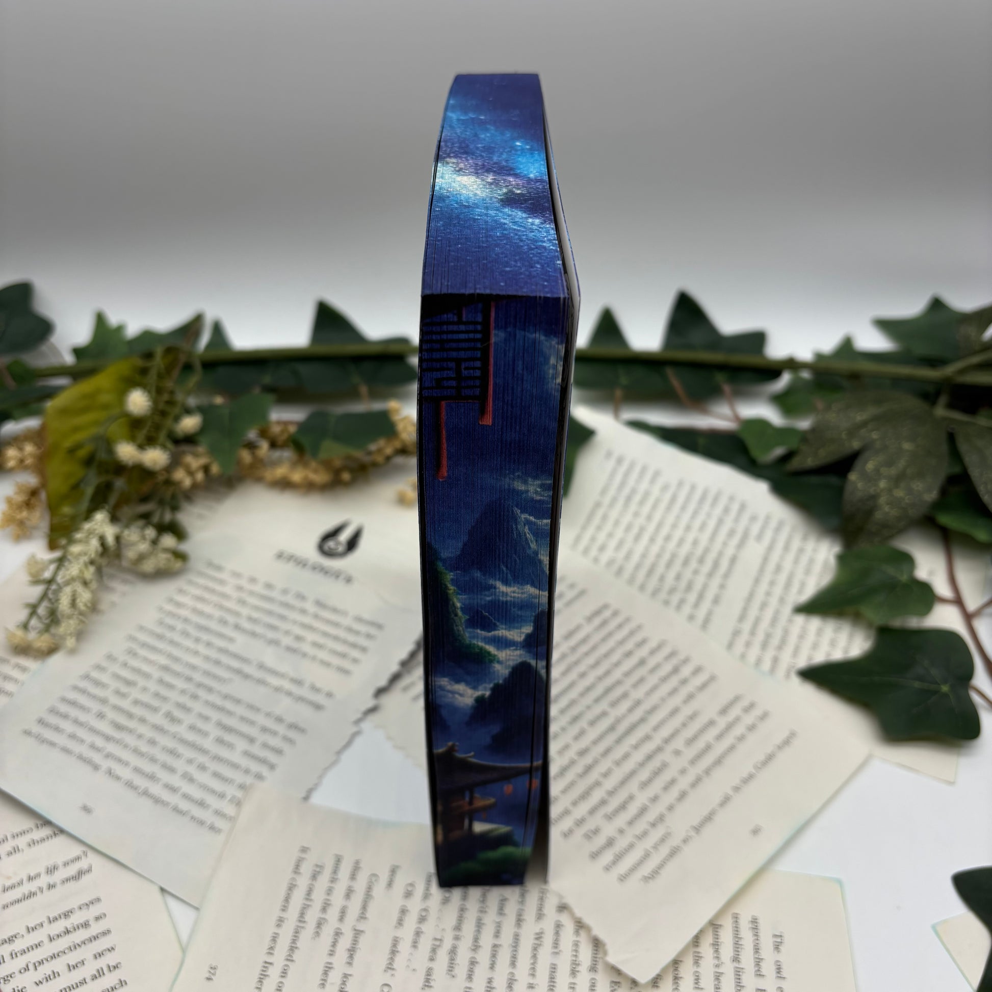 Song of Silver Flame Like Night by Amélie Wen Zhao special edition paperback with custom designed edges side view