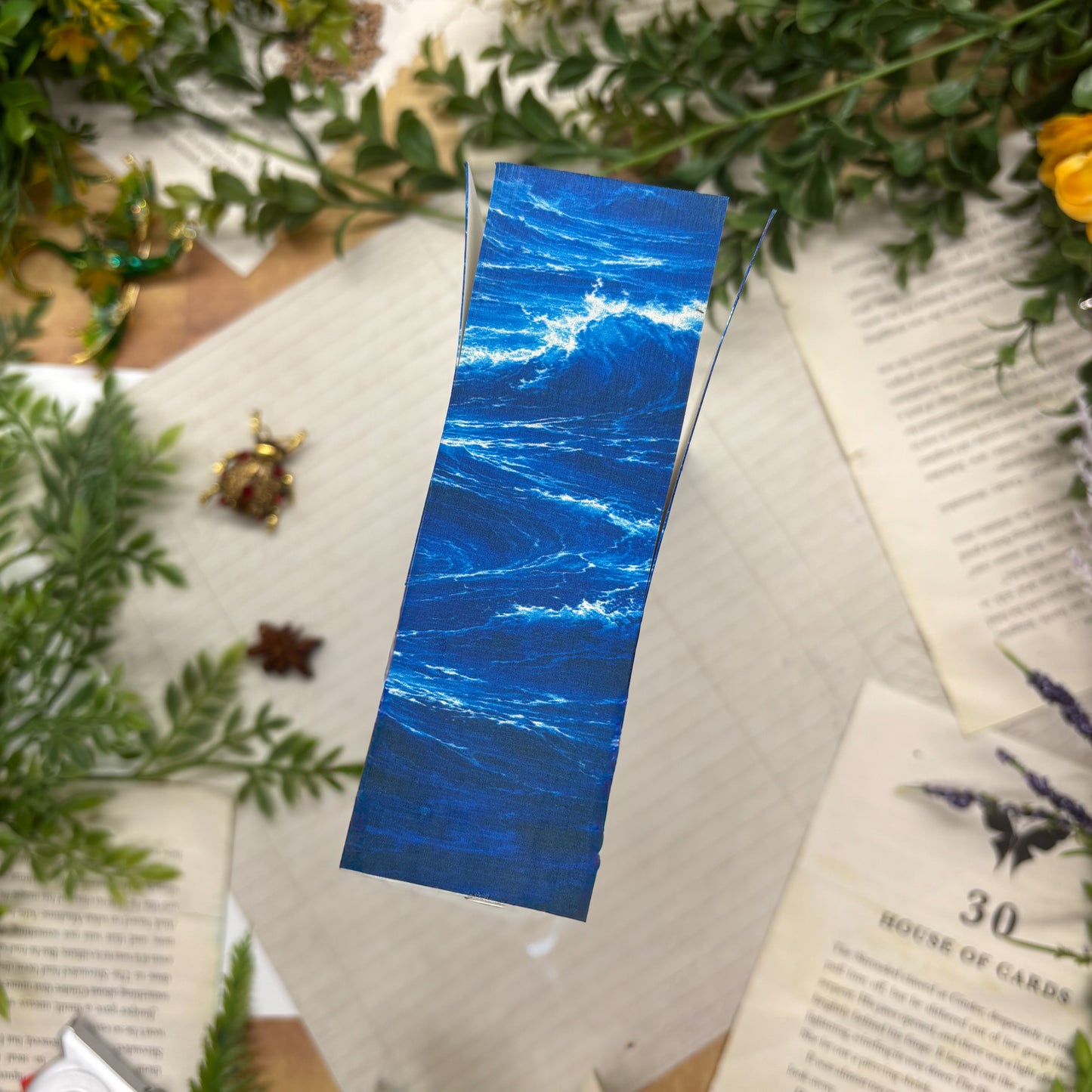 The Sword of Kaigen by M. L. Wang special edition paperback with custom designed edges bottom view