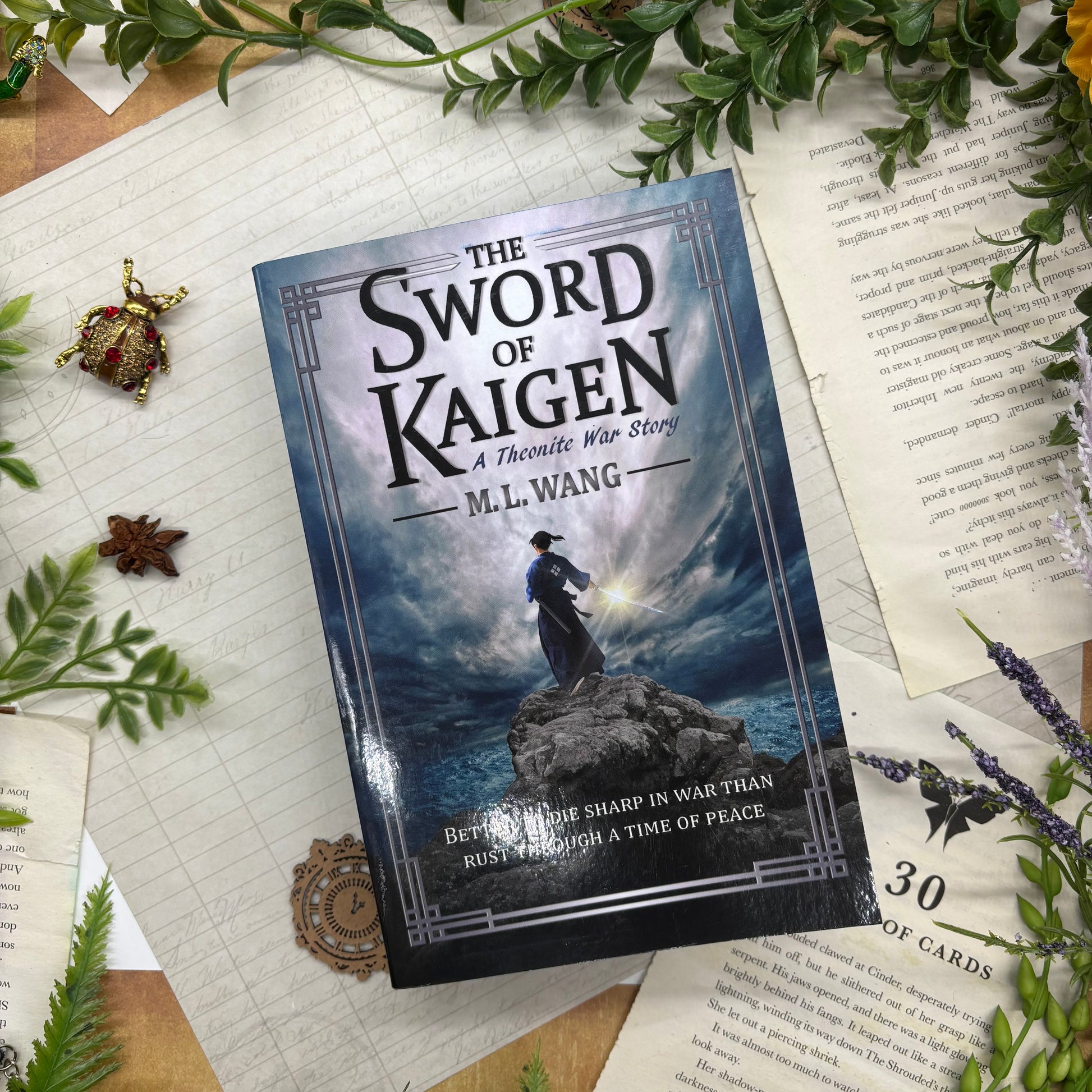 The Sword of Kaigen by M. L. Wang special edition paperback with custom designed edges front cover view