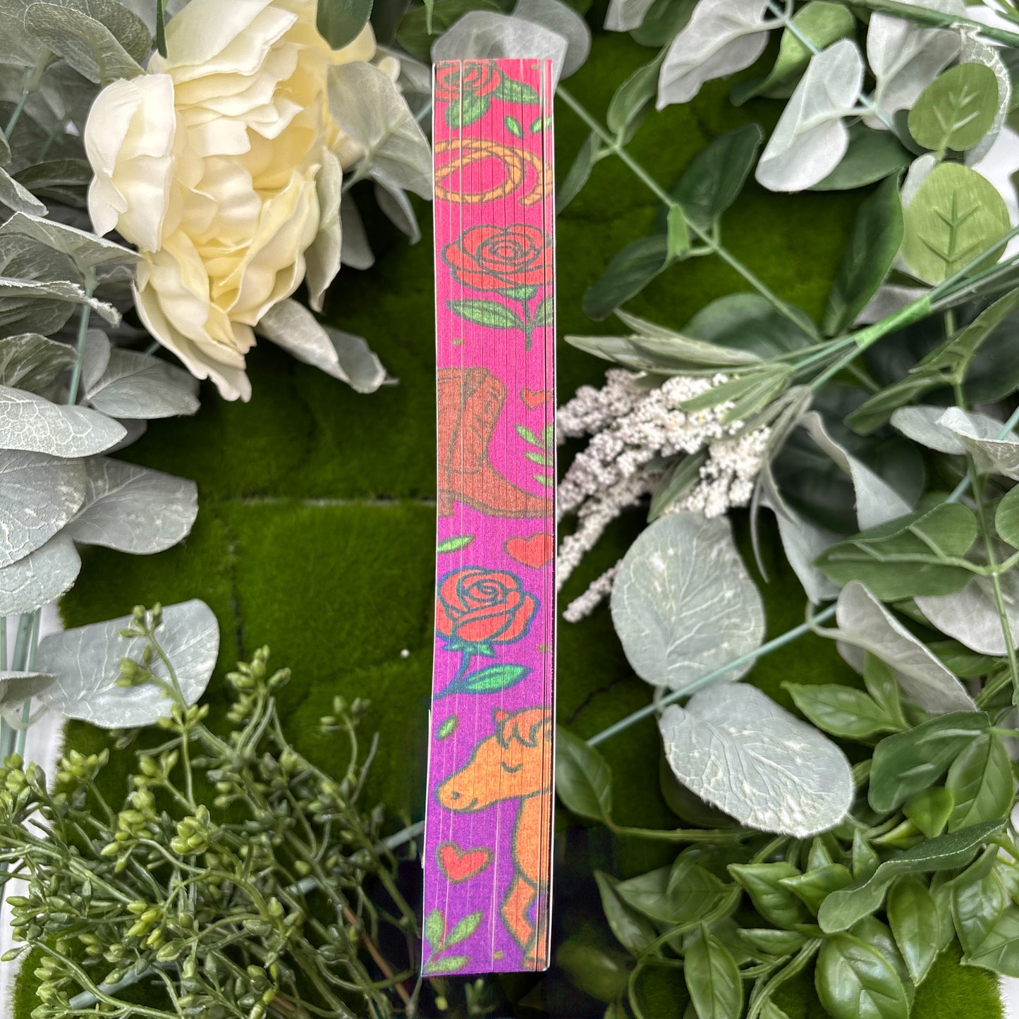 view of Wild and Wrangled paperback showing custom sprayed edges special edition